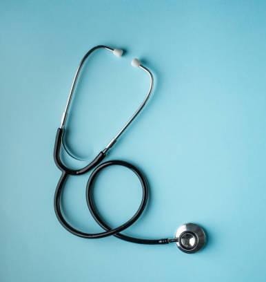 Healthcare professional helping patient